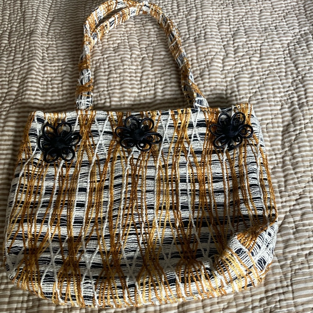 black, white, mustard multicolored tote bag with floral decoration